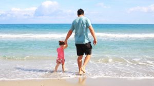 Dad on Beach with Daughter, Walking In Water